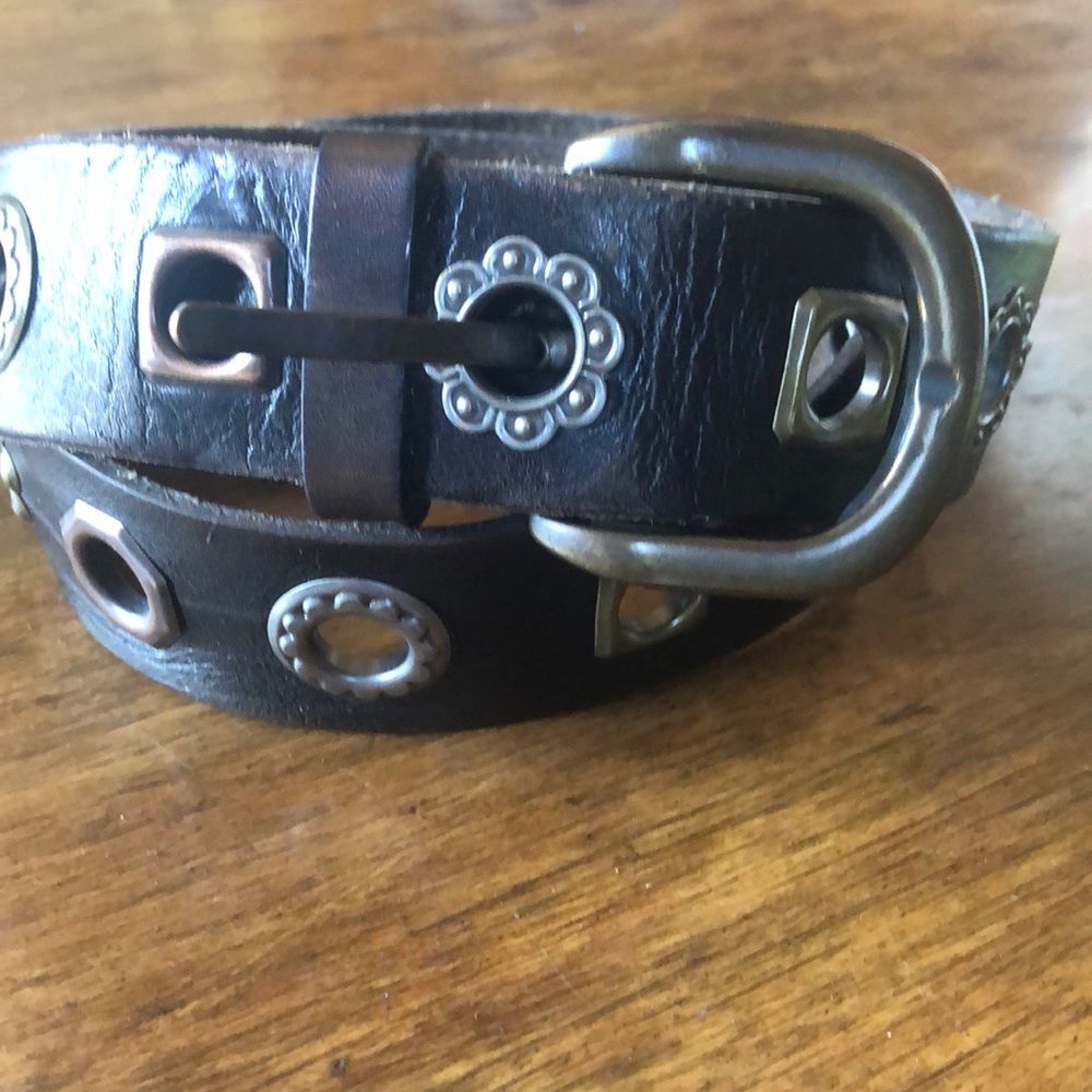 Black leather and brass belt.